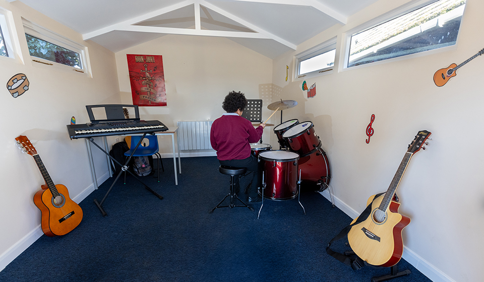 Pupil playing the drums